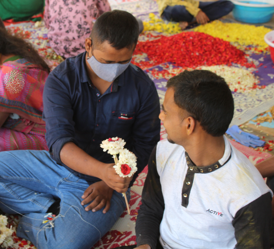 An image of two men making flowers
